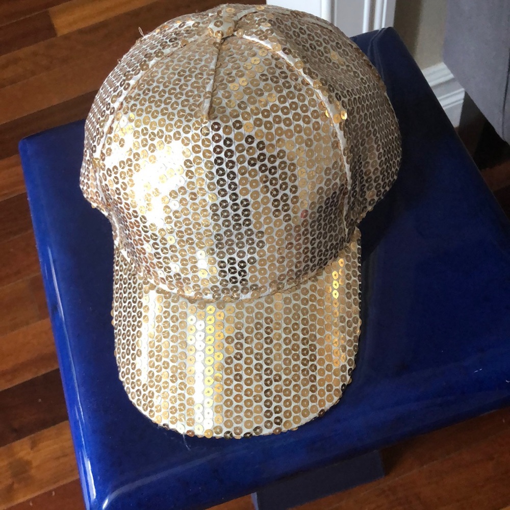 Gold sequenced baseball cap with snap back.